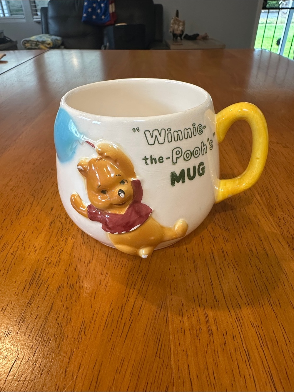 Antique 1964 “Winnie the Pooh’s mug.” White ceramic mug, yellow handle. Enesco